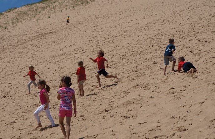Kids running down the Dune Climb