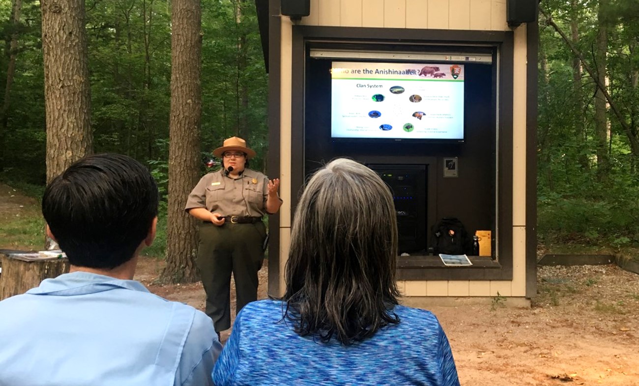 Ranger giving presentation outside in amphitheater