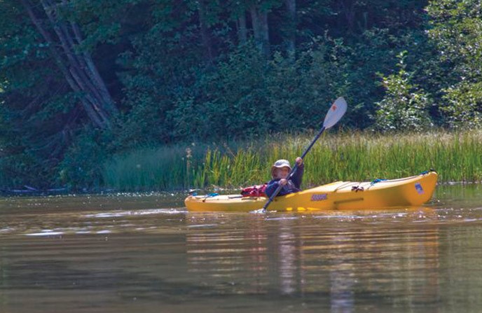 Young boy kayaking the Platte River