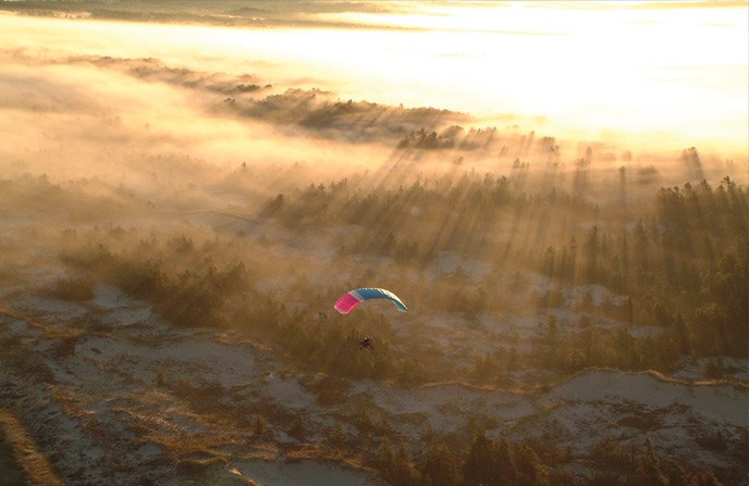 paragliding over Lake Michigan shoreline paragliding over Lake Michigan shoreline
