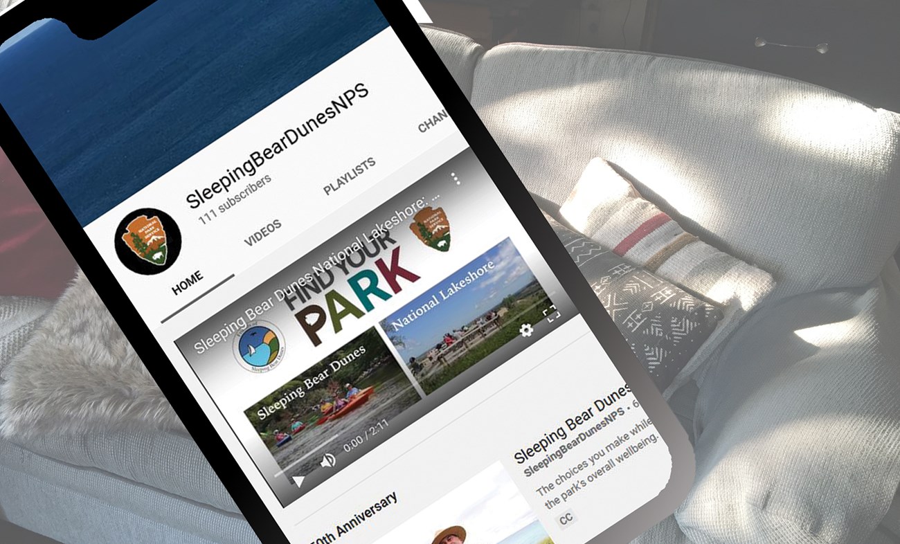 Close up of iphone with park youtube page on screen