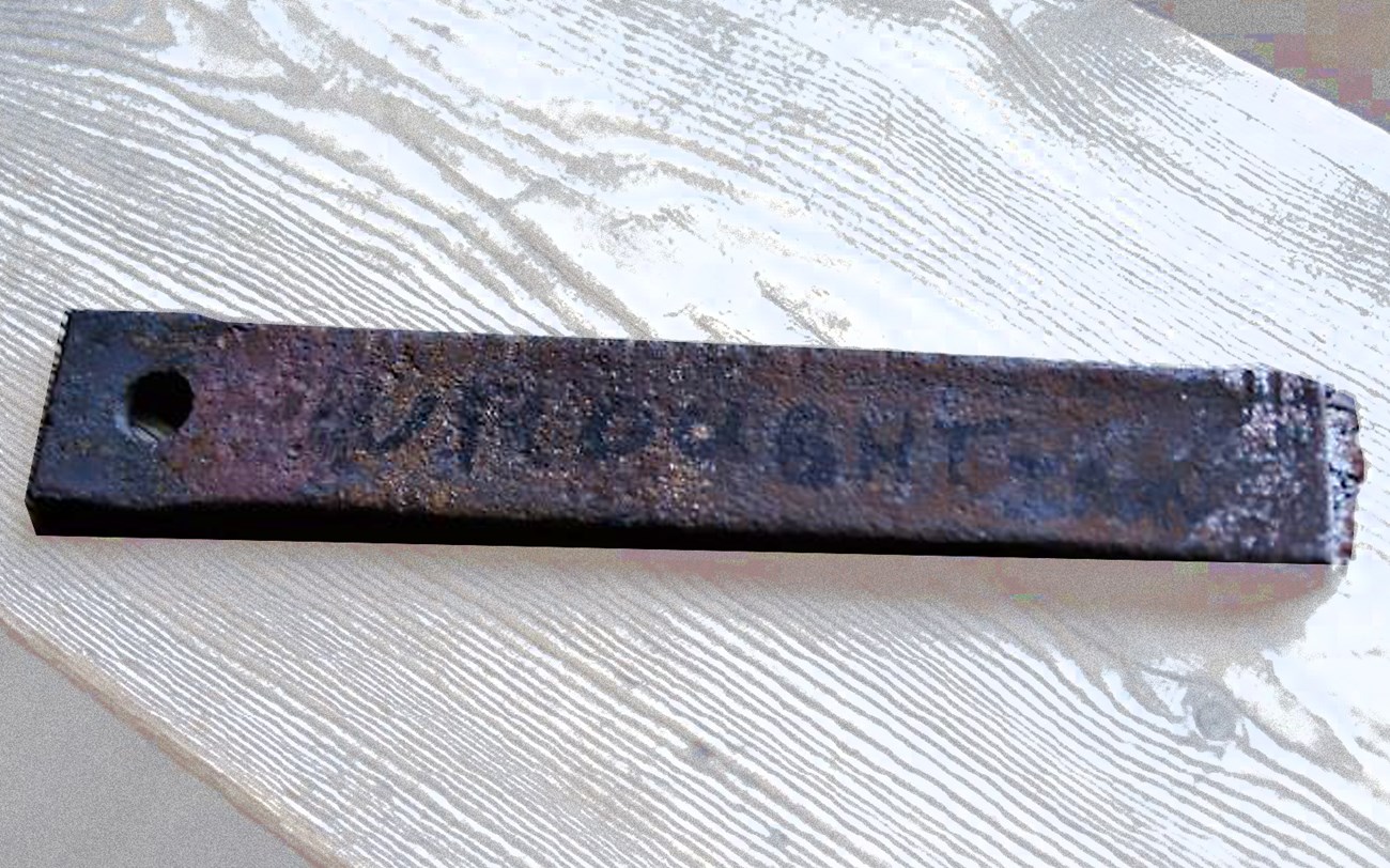 Long narrow strap with fading lettering on it