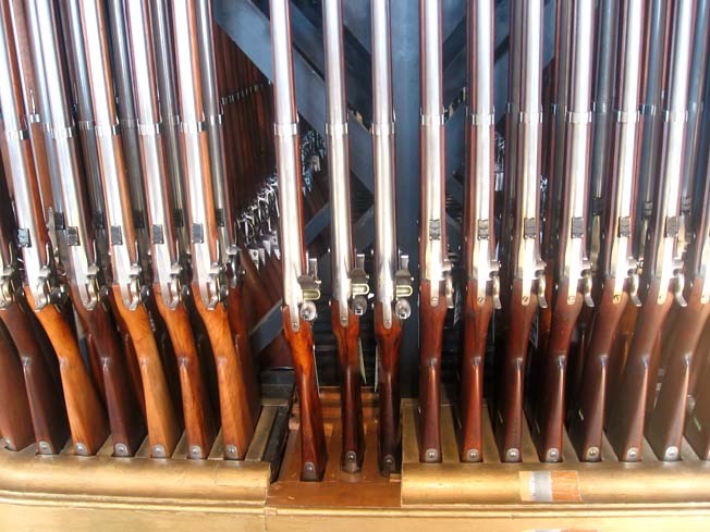 M1816 flintlock muskets shown alongside later M1861 rifle muskets