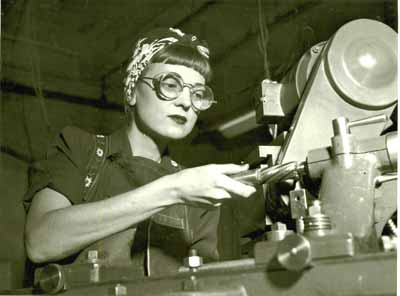 An Armory worker grinding vertical milling cutters