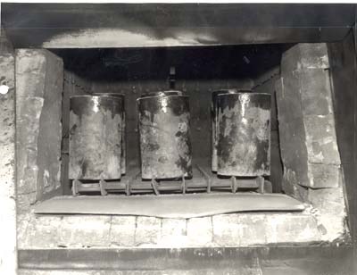 The cans holding the casting plaster molds were heated.