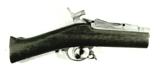 Wooden center hammer Trapdoor rifle breech mounted in wooden stock