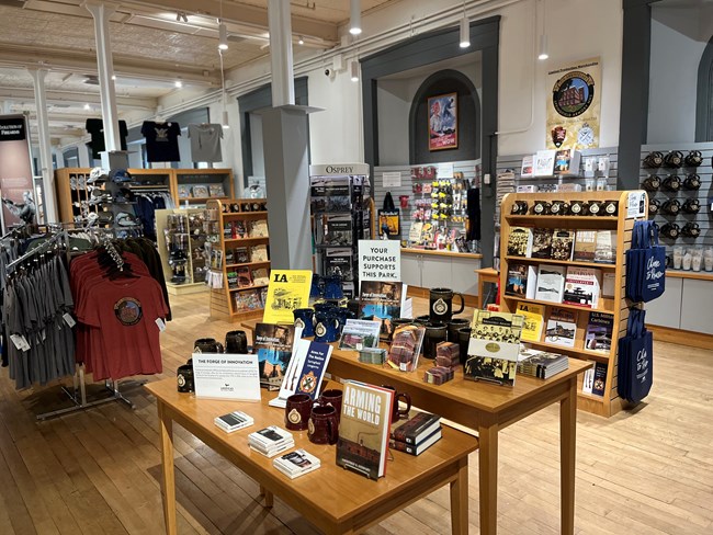 photograph of park store.  Table with objects for sale in the foreground.