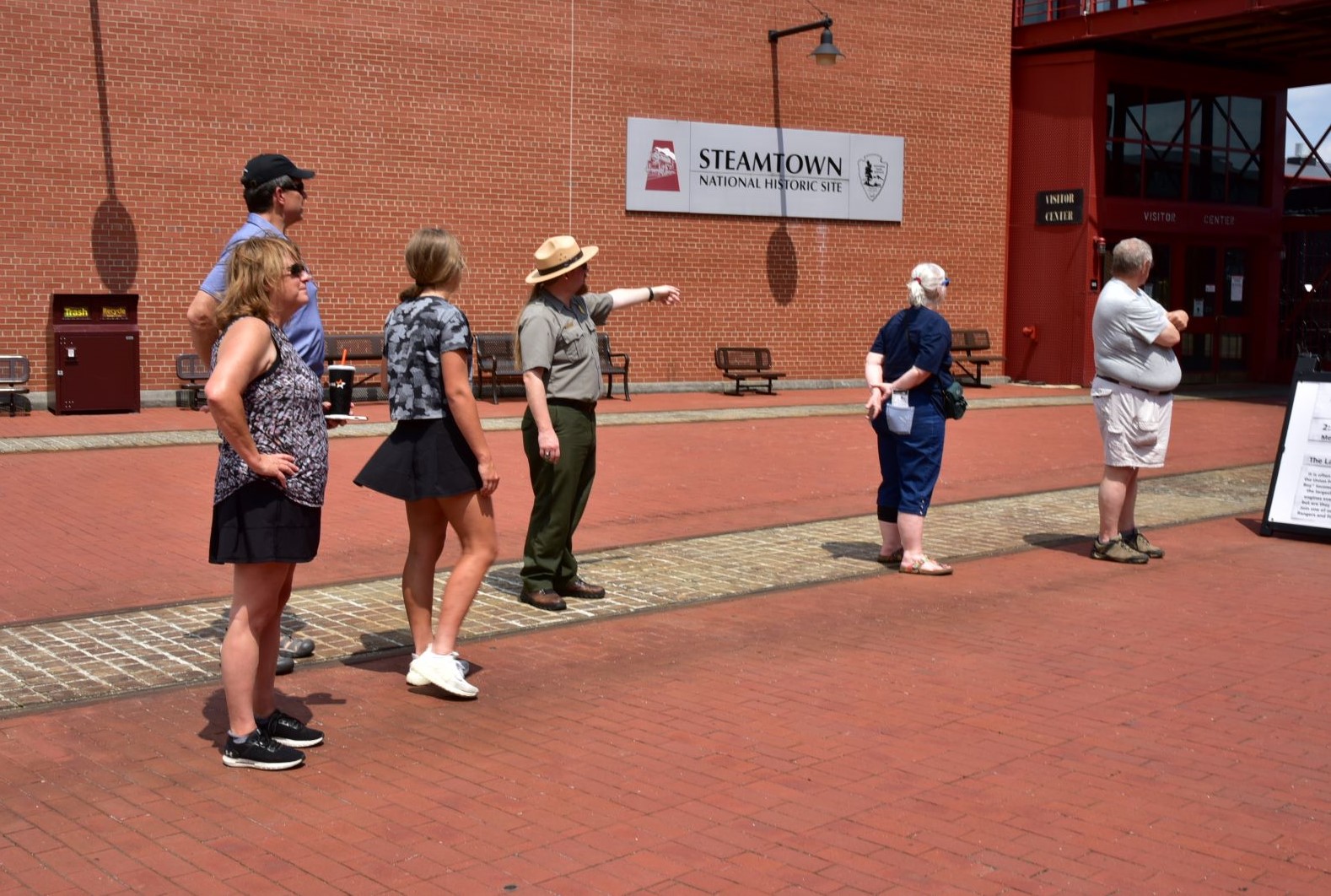 A ranger presenting to a group of 5 people