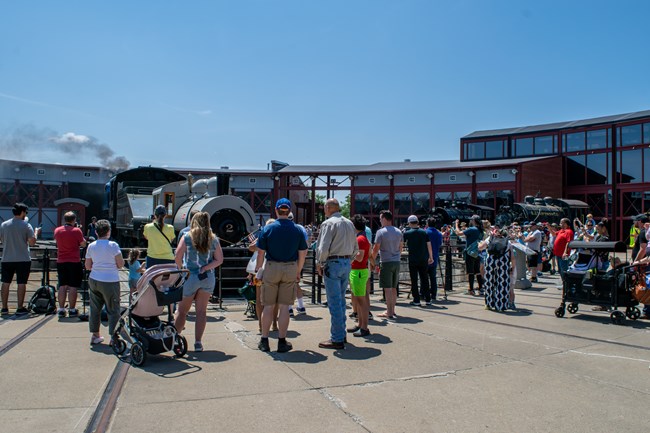 Crowd of visitors gather around turntable as Bullard No. 2 makes its debut