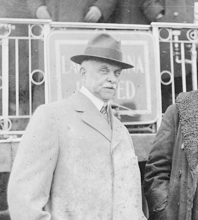William Truesdale standing aside another man in front of a Lackawanna Railroad business car