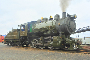 Baldwin Locomotive Works #26, an 0-6-0 steam locomotive, in green paint and white lettering in the Steamtown NHS yards