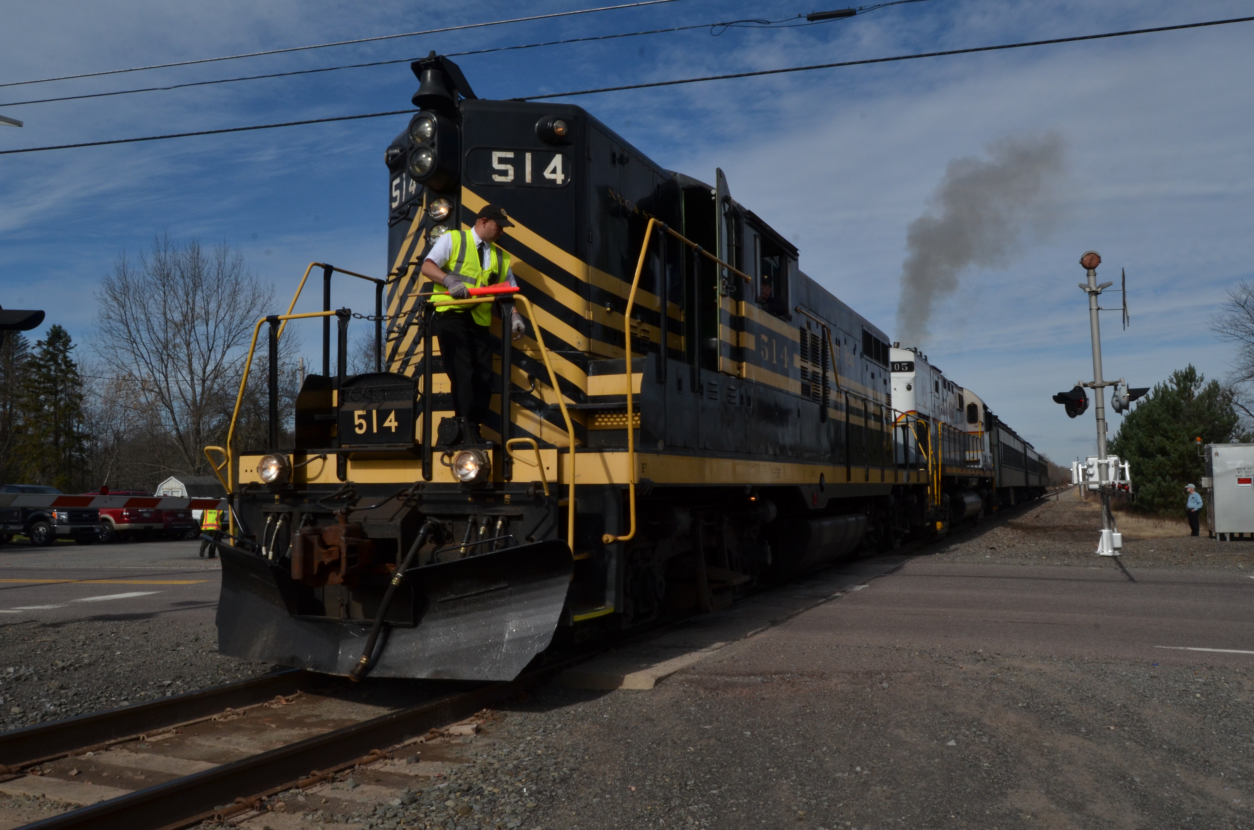volunteer spots train as it crosses a road