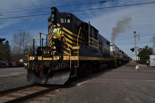 volunteer spots train as it crosses a road