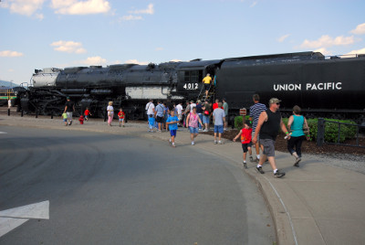 Visitors use stairs to view the cab interior of Union Pacific "Big Boy" #4012