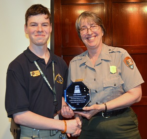 Volunteer Aiden Shafer receives the Regional Hartzog “Youth Volunteer Award," from Superintendent Debbie Conway