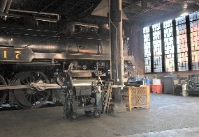 CP 2317, a steam locomotive, sits in one of the stalls of Steamtown's restored roundhouse.