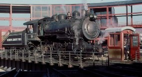 Baldwin Locomotive Works #26, a switcher-type 0-6-0 steam locomotive, in black paint with white lettering on the turntable