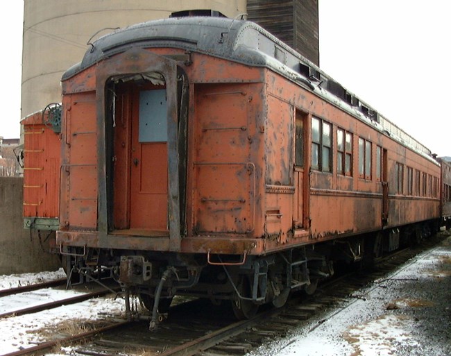 Boston and Maine Dining Car #84 in orange paint. Boston and Maine Dining Car #84 in orange paint.