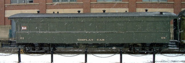 Quebec Railway, Light and Power Day Coach #124, painted in dark green with ID number painted in yellow in Steamtown NHS yards. Not open for display.