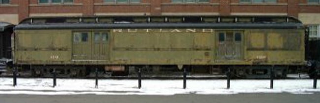 Rutland Railroad #129, Baggage-Express, faded dark green color, yellow lettering and number identification, displayed in Steamtown NHS rail yard.