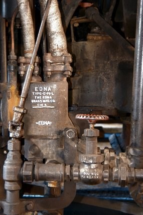 An EDNA water pump feeds water into a steam locomotive's injector to force the water into the high pressure boiler.