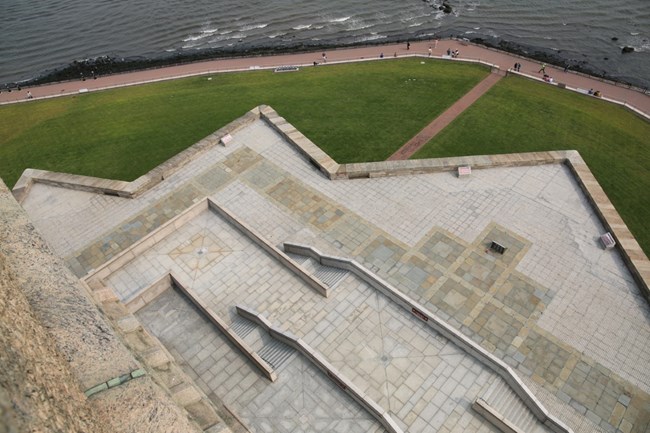 A photo looking down at the top of a granite structure.