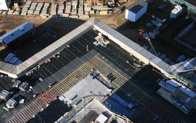 Waterproof membrane, snowmelt and new granite pavers installed on a section of the terreplein