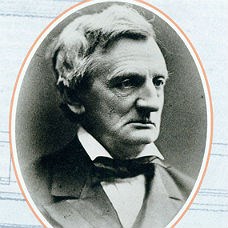 An older gentleman with a bowtie and a stern expression.