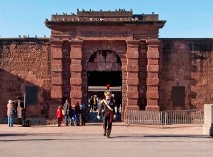 A front view of a red sandstone fort.