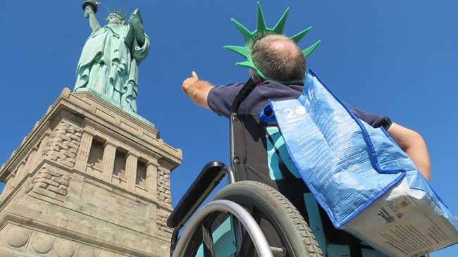 A visitor is looking up at the Statue of Liberty from the Fort Wood level.