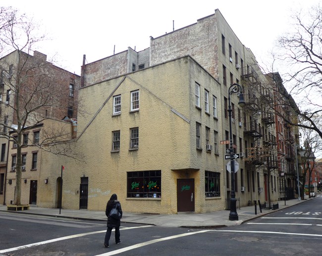 Julius' Bar, a two-story yellow stucco building, has been open since the 1860s