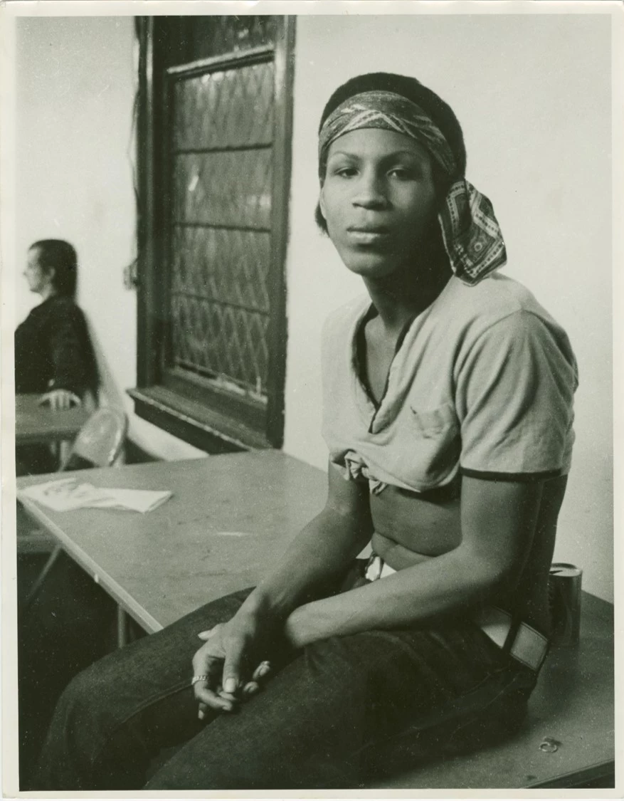 Zazu Nova at a Gay Liberation Front Meeting, 1970 Zazu Nova sitting on top of a table
