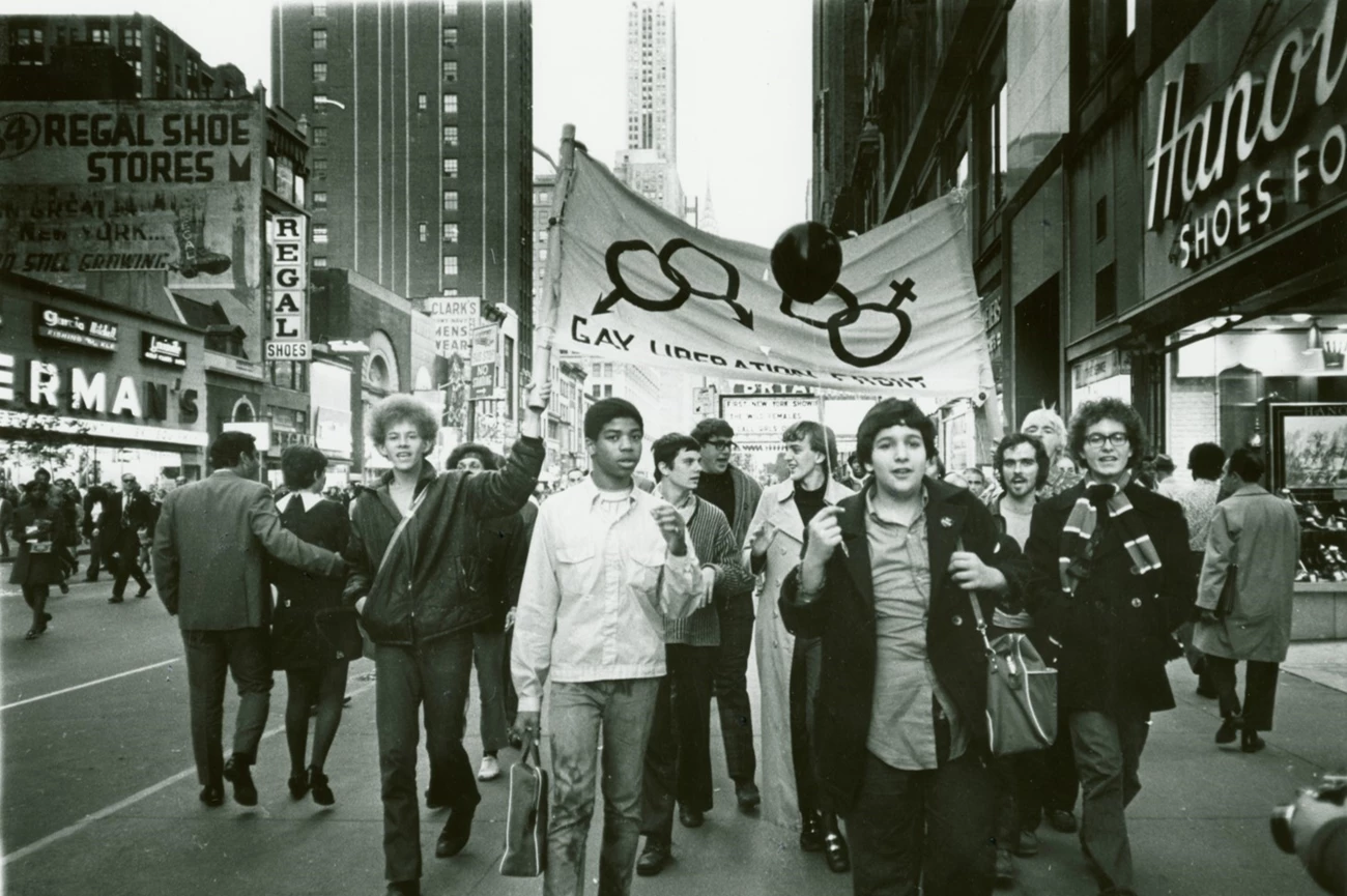 Gay Liberation Front Marches on Times Square, New York City, 1969 Gay Liberation Front Marches on Times Square with banner that reads 'Gay Liberation Front'