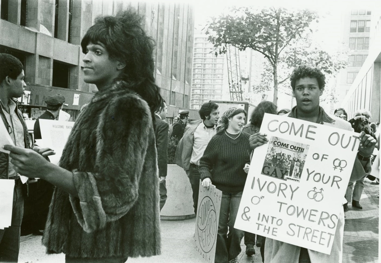 Marsha P. Johnson Hands Out Flyers in Support of Gay Students at N.Y.U., 1970 Marsha P. Johnson handing out flyers with NYC students in the background