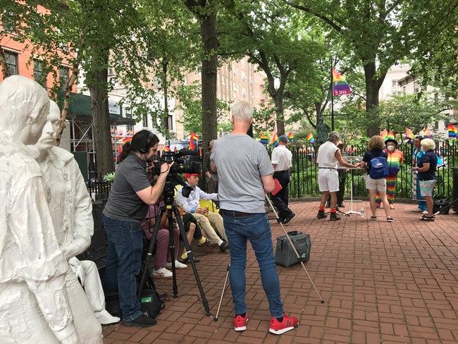 Individuals gather and prepare for a special event.