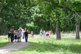Field Trip 2015 A park ranger leads a group of students on a hike.