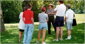 Visitors listen to a ranger program. Visitors listen to a ranger program.