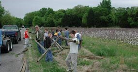 Scouts building a fence