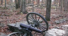 Broken cannon in rocks