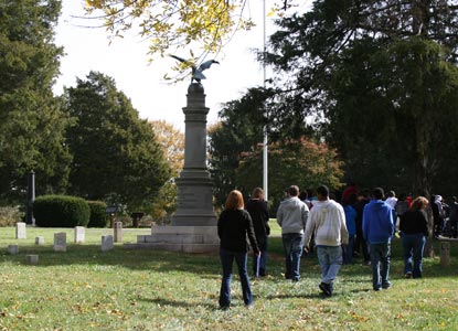 McGavock High School students walk through Stones River National Cemetery.
