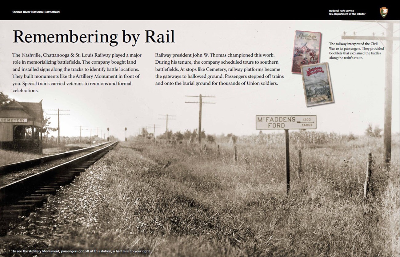 Exhibit featuring black and white photo of railroad tracks and covered platform with a sign reading "Cemetery" on the left. A sign on the right of the tracks reads "McFadden's Ford 1200 yards." Two color booklets appear in the top right.