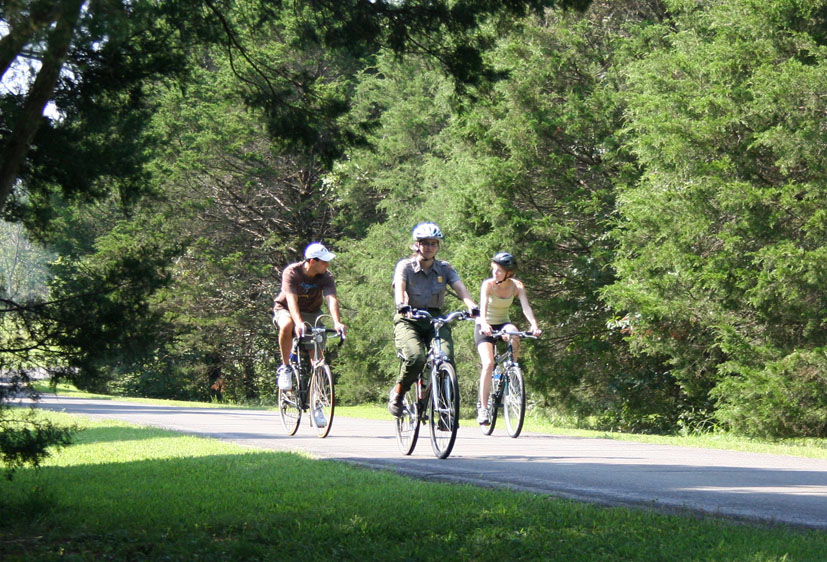 Ranger and visitors riding bicycles Ranger and visitors riding bicycles