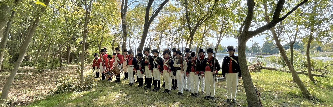 Living historians along the natural shoreline at Todd's Inheritance