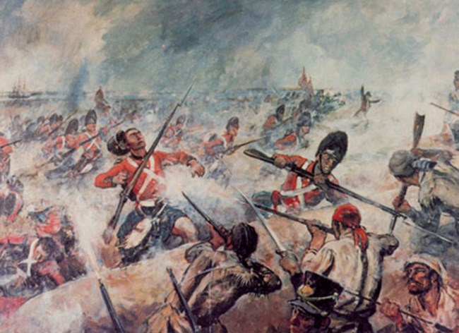 Many black men fighting with muskets on a battlefield. The men in the background wear red coats. The men in the foreground wear tattered clothing in various shades of brown.