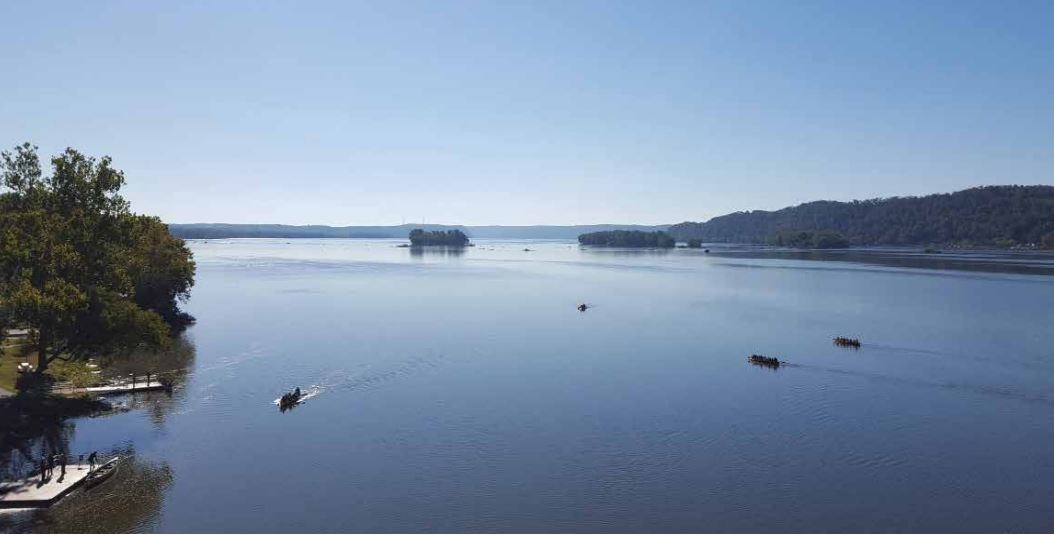 Aerial image of boats on a river.
