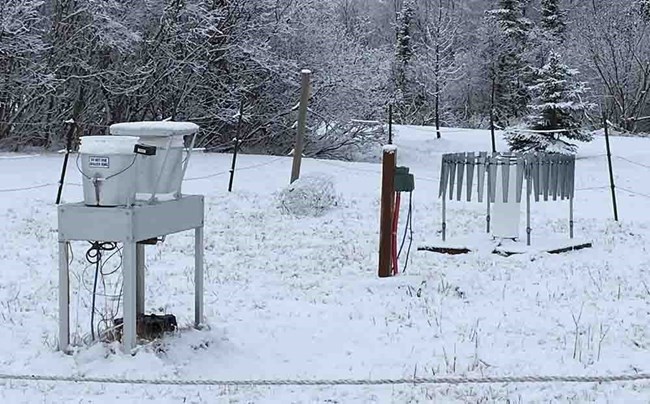 An air quality monitoring station, snow covered.