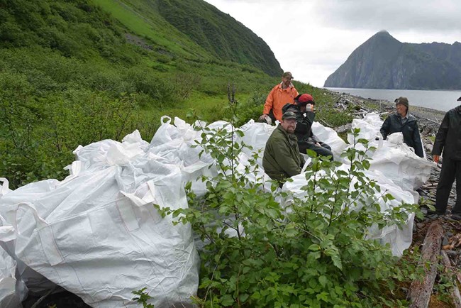 A marine debris clean up crew waits for pick up