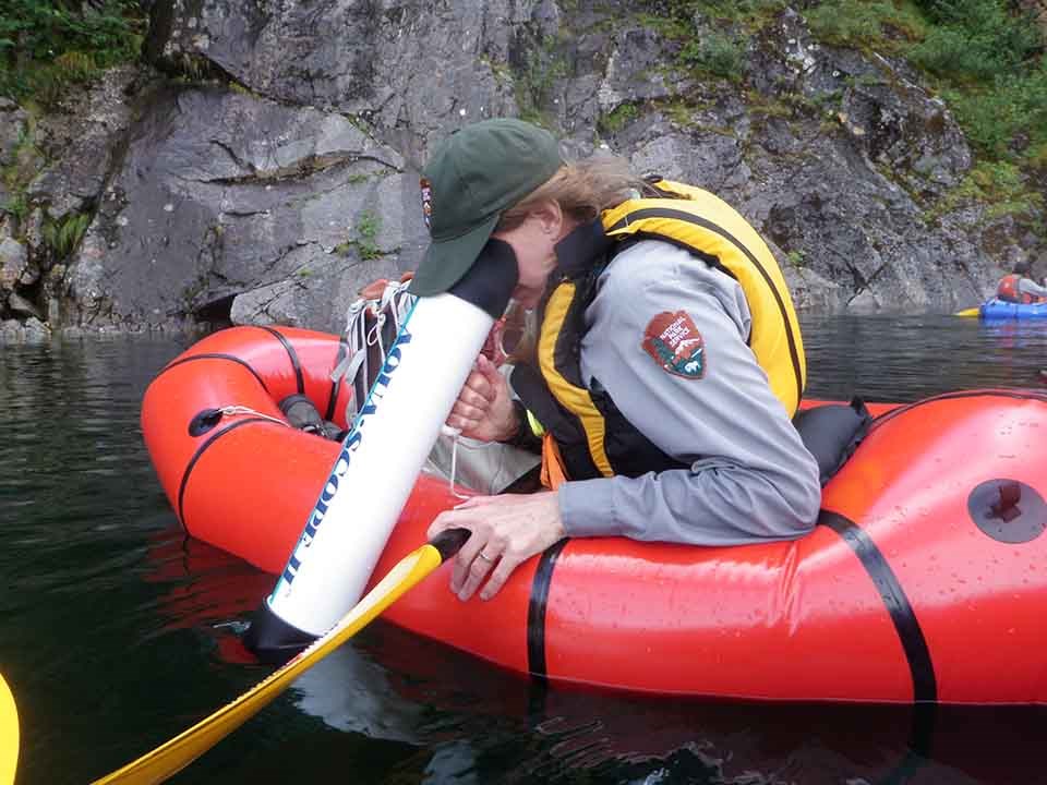 Surveying to prevent weeds A field researcher surveys for weeds in Delight Lake, Kenai Fjords.