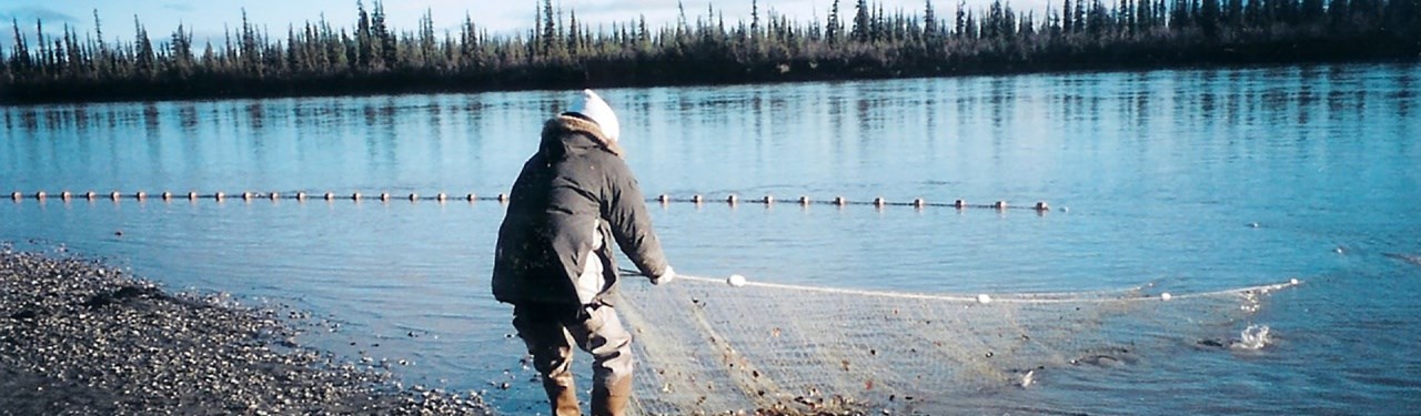 A woman subsistence fishing