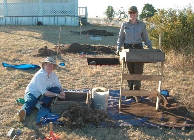 Two people excavate at FOVA